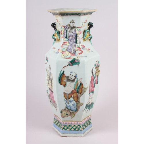 67 - A Chinese porcelain hexagonal famille rose vase with immortal decoration, 16.5