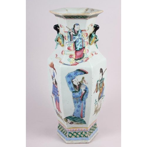 67 - A Chinese porcelain hexagonal famille rose vase with immortal decoration, 16.5