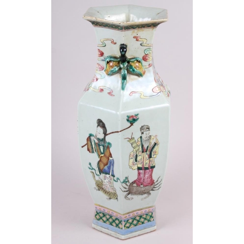 67 - A Chinese porcelain hexagonal famille rose vase with immortal decoration, 16.5