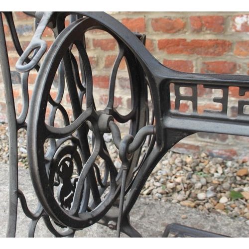 671 - A cast iron sewing machine base, now converted as an occasional table