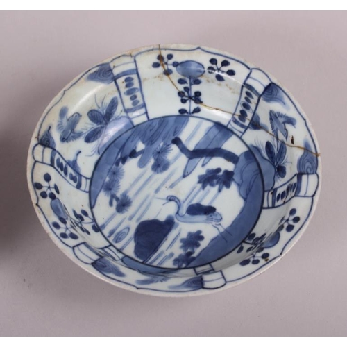 69 - A Chinese tea bowl decorated with cranes, three pieces of Chinese export blue and white china and an... 