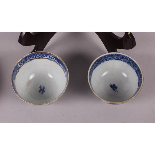 69 - A Chinese tea bowl decorated with cranes, three pieces of Chinese export blue and white china and an... 