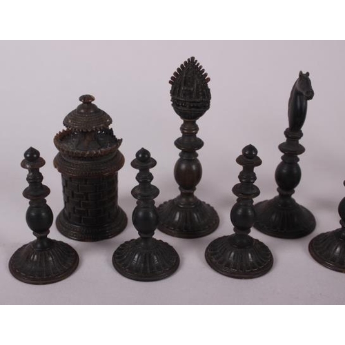 78 - A 19th century Indian turned ivory and horn chess set, king 4 1/2