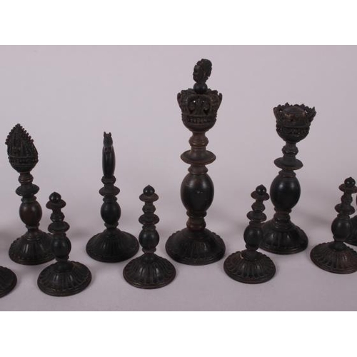 78 - A 19th century Indian turned ivory and horn chess set, king 4 1/2