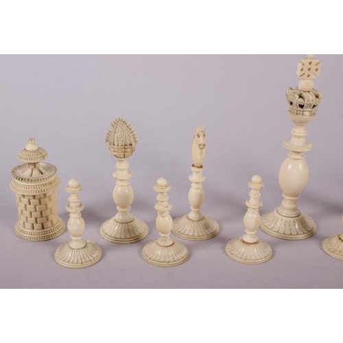 78 - A 19th century Indian turned ivory and horn chess set, king 4 1/2