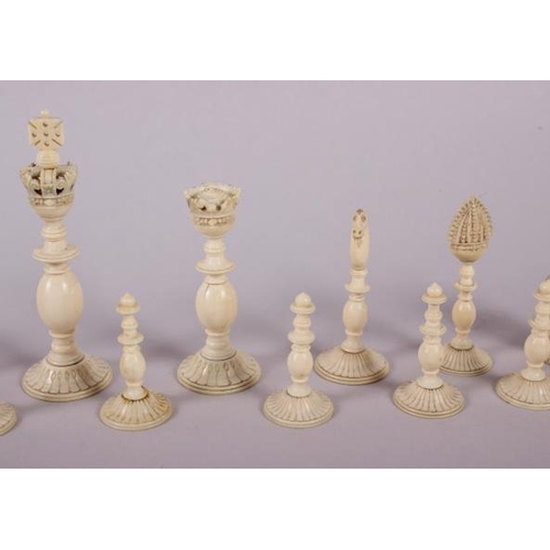 78 - A 19th century Indian turned ivory and horn chess set, king 4 1/2