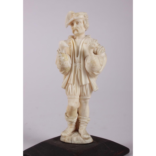 79 - A 19th century Dieppe ivory carving of a gentleman with two geese, on plinth base, 4 3/4