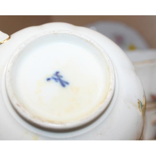 8 - A quantity of early 20th century Meissen teacups, saucers and a sugar bowl (one cracked)