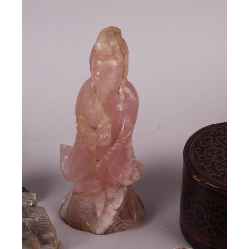 80 - A rose quartz figure of Kuan Yin, 8 1/2