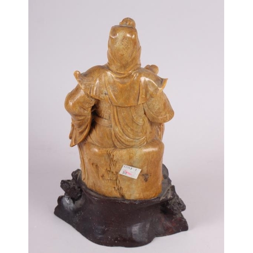 81 - A Chinese soapstone carved figure of an immortal, 11 1/2