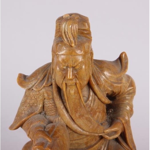 81 - A Chinese soapstone carved figure of an immortal, 11 1/2