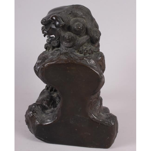 82 - A Chinese bronze figure of a standing lion, 8