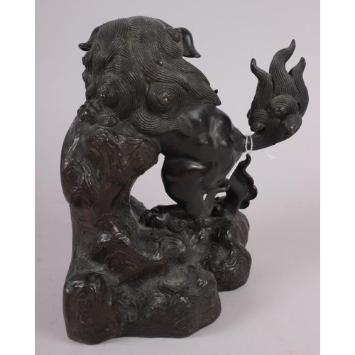 82 - A Chinese bronze figure of a standing lion, 8