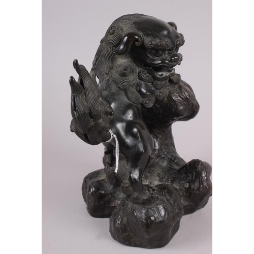 82 - A Chinese bronze figure of a standing lion, 8