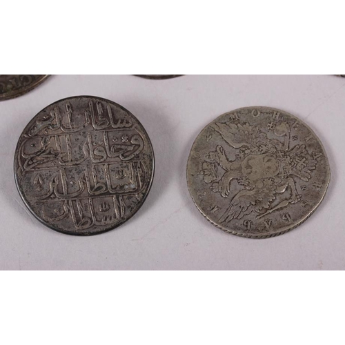 303 - A French silver coin, dated 1731, another dated 1770, a Russian silver 1-ruble coin, dated 1756, ano... 