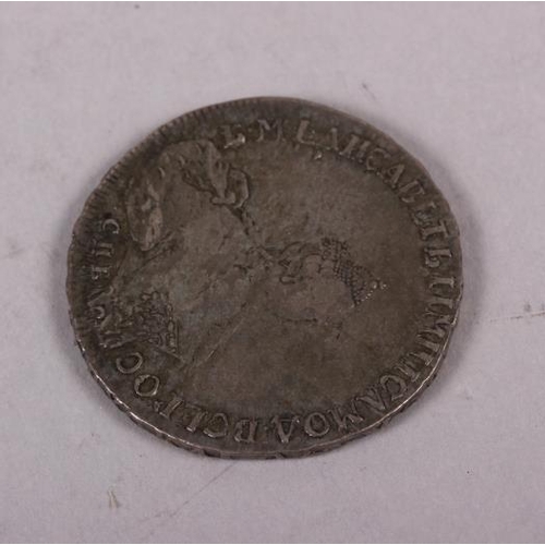 303 - A French silver coin, dated 1731, another dated 1770, a Russian silver 1-ruble coin, dated 1756, ano... 