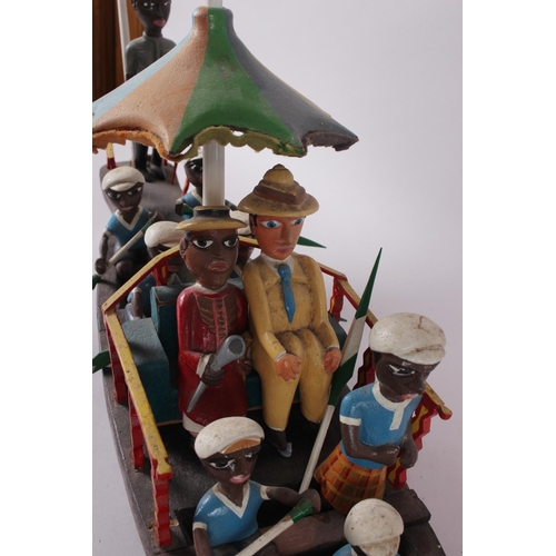 150 - A vintage wooden model boat with figures