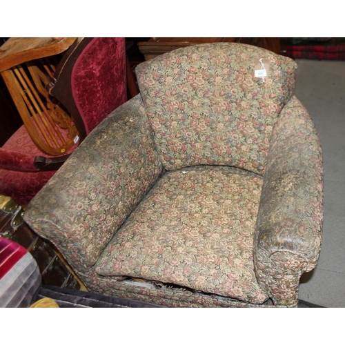 605 - An early 20th century tub-shape armchair, on square taper supports (for restoration)