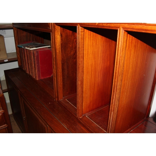 628 - A Chinese hardwood wall unit, fitted open shelves and drop front compartment over three doors, 68