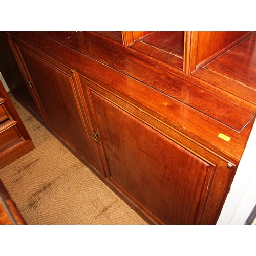 628 - A Chinese hardwood wall unit, fitted open shelves and drop front compartment over three doors, 68