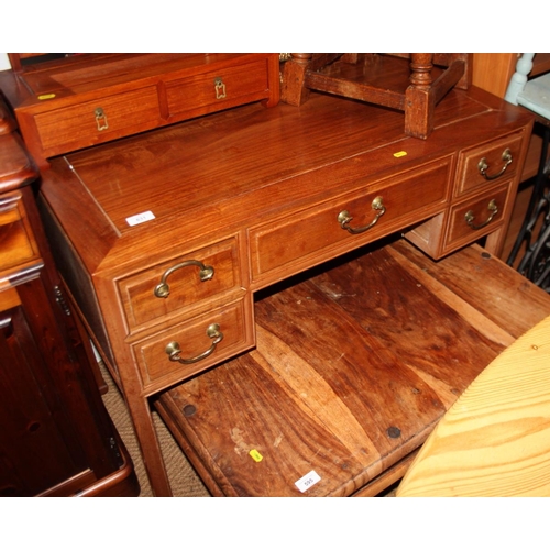 631 - A Chinese hardwood desk, fitted one long and four small drawers, on shaped supports, 26