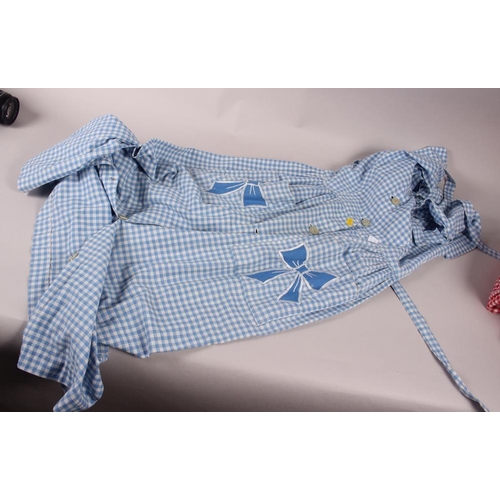 174 - A 1950's Romeda blue gingham day dress, another similar in red, a vintage hand-made peach evening go... 