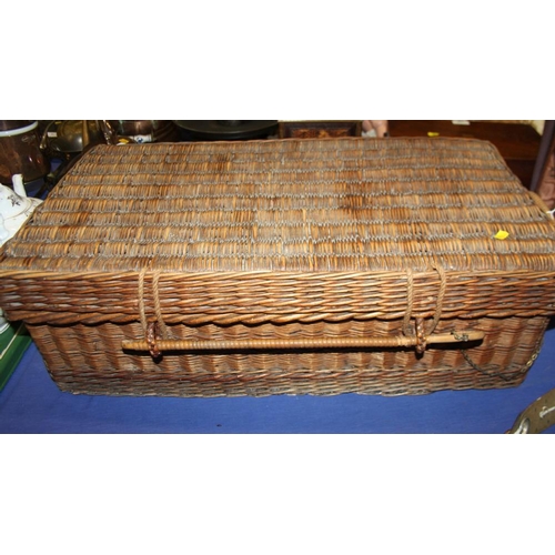 185 - An early 20th century wickerwork picnic basket with part fitted interior, tin plates, cutlery, stora... 