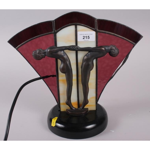 215 - An Art Deco design lamp with athletes and glass panel, 11