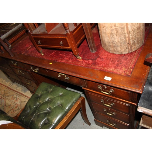 447 - An Edwardian pedestal desk with red tooled leather lined top, fitted nine drawers, on bracket feet, ... 