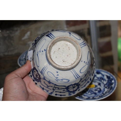 62 - A Chinese blue and white bowl with landscape, figure and floral decoration, 6 1/2