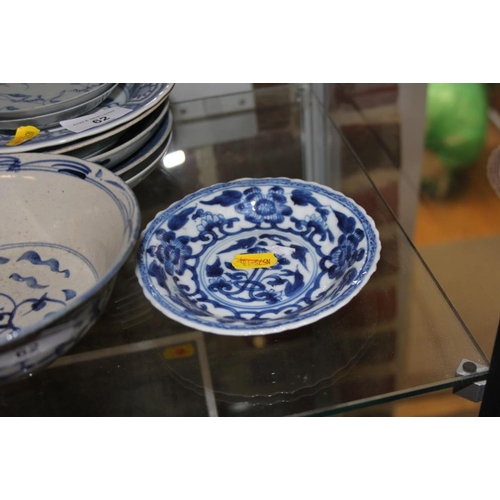 62 - A Chinese blue and white bowl with landscape, figure and floral decoration, 6 1/2