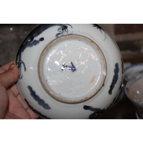 62 - A Chinese blue and white bowl with landscape, figure and floral decoration, 6 1/2