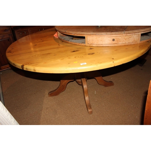 660 - A pine circular dining table, on turned pedestal and quadruple splay supports, 60