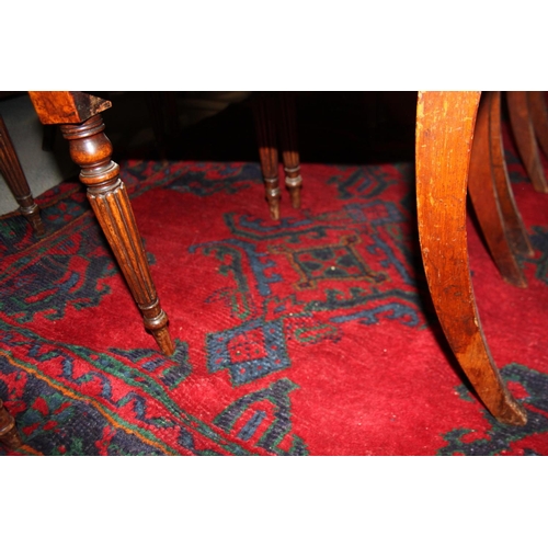 666 - A turkey carpet of traditional design in shades of red, green, blue and yellow, 92