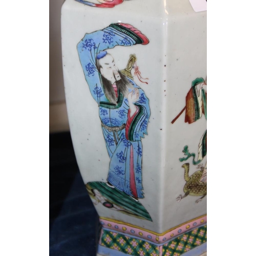 67 - A Chinese porcelain hexagonal famille rose vase with immortal decoration, 16.5