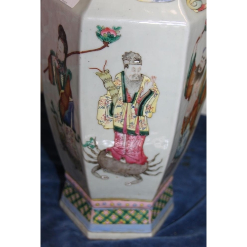 67 - A Chinese porcelain hexagonal famille rose vase with immortal decoration, 16.5