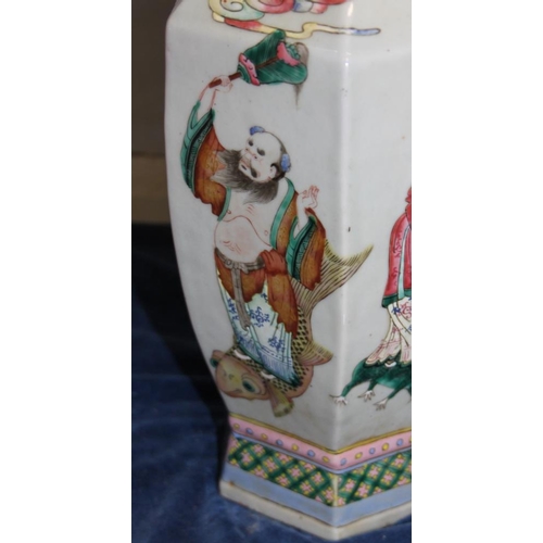 67 - A Chinese porcelain hexagonal famille rose vase with immortal decoration, 16.5