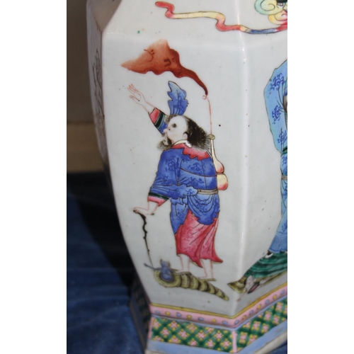 67 - A Chinese porcelain hexagonal famille rose vase with immortal decoration, 16.5