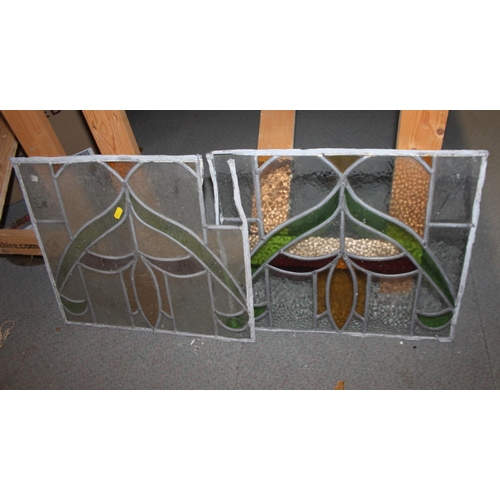 670 - Three matching lead lined stained glass panels, 15