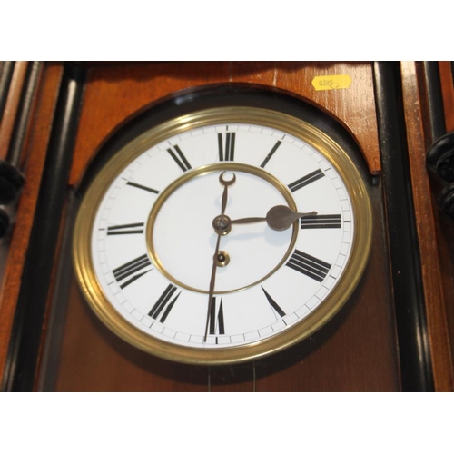 97 - A 19th century walnut cased Vienna style wall clock with white enamel dial, 52