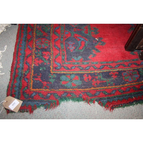 666 - A turkey carpet of traditional design in shades of red, green, blue and yellow, 92