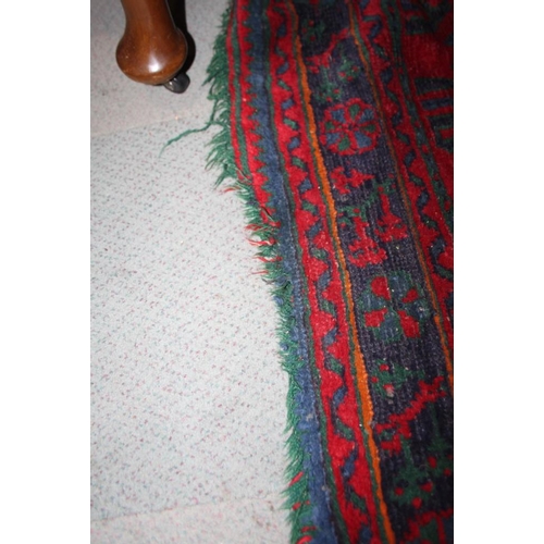 666 - A turkey carpet of traditional design in shades of red, green, blue and yellow, 92