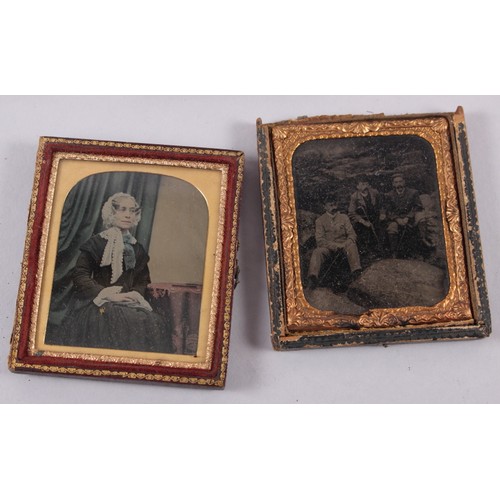 414 - A pair of mid 19th century photographic portraits of a man and woman, in union cases with gilt borde... 