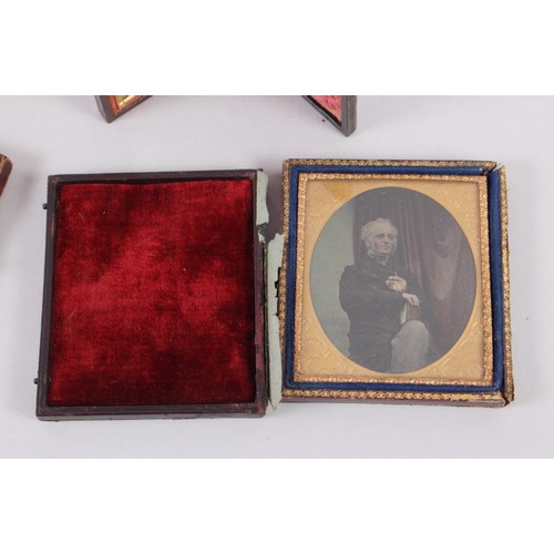 414 - A pair of mid 19th century photographic portraits of a man and woman, in union cases with gilt borde... 