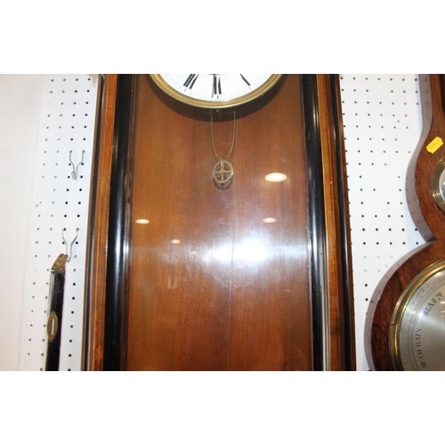 97 - A 19th century walnut cased Vienna style wall clock with white enamel dial, 52