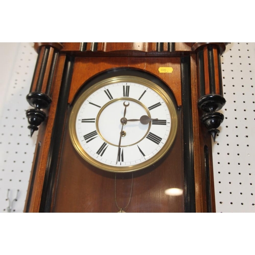 97 - A 19th century walnut cased Vienna style wall clock with white enamel dial, 52