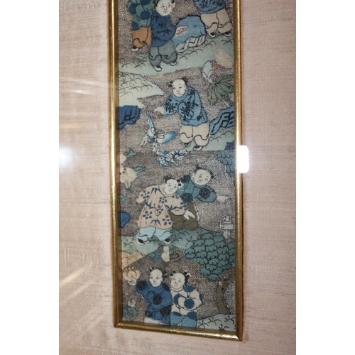 173 - A pair of Chinese embroidered panels decorated figures, 11 1/2