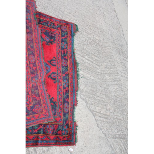 666 - A turkey carpet of traditional design in shades of red, green, blue and yellow, 92