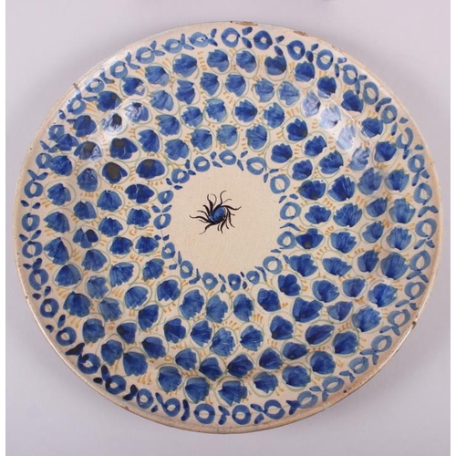 5 - An 18th century Delft plate with all-over leaf and tendril design, 12