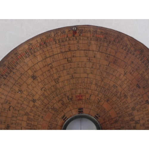 105 - A Chinese luo pan Feng-Shui compass, in later hardwood and brass inlaid frame, compass 7 1/4